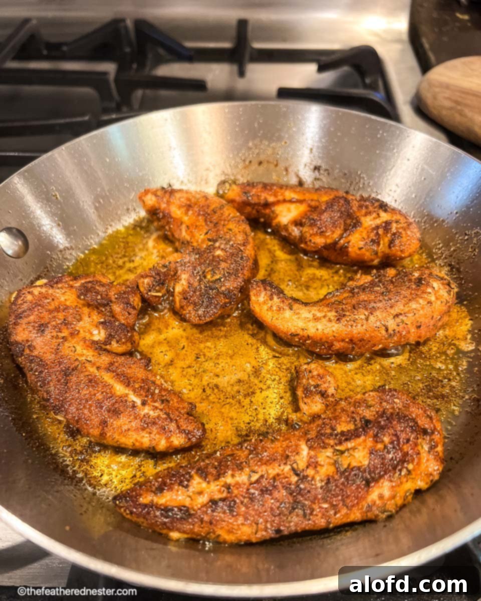 Cajun-Spiced Chicken Strips 8 photo shows how to blacken chicken in a cast iron skillet.