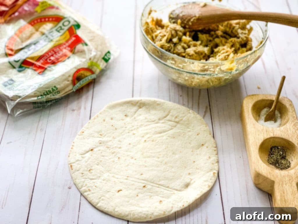 Luscious Sour Cream Chicken Enchiladas 4 photo of flour tortilla waiting to be filled with chicken mixture