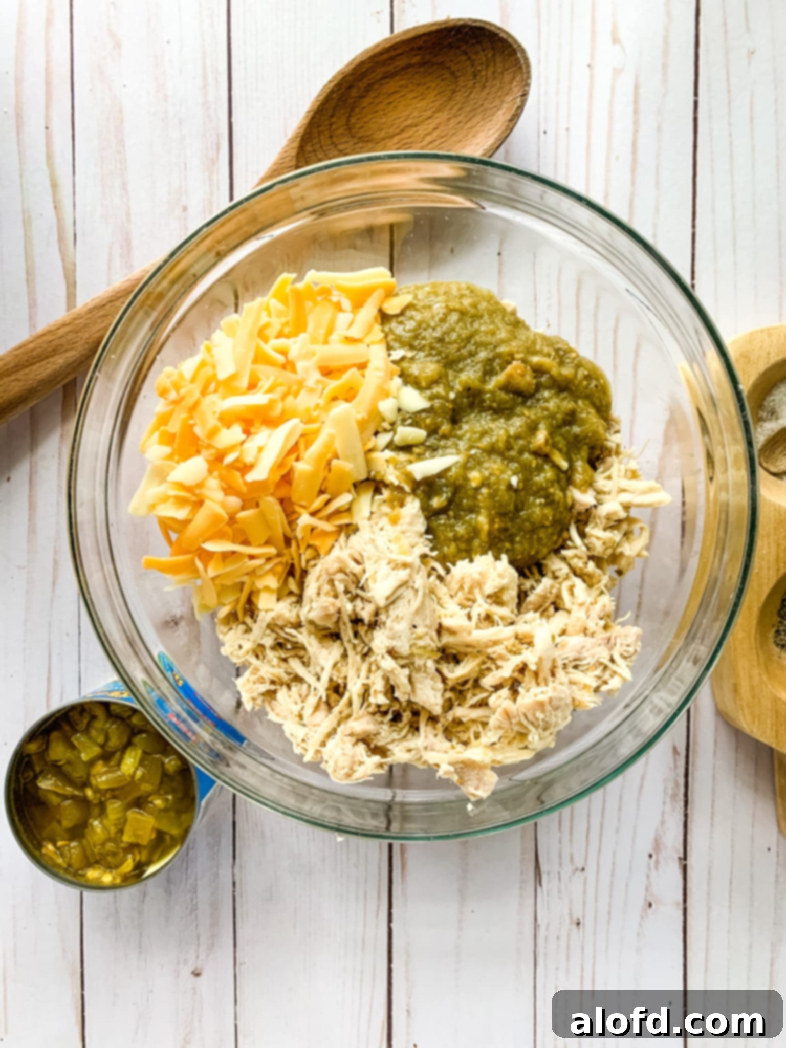 Luscious Sour Cream Chicken Enchiladas 7 chicken enchilada mix on a bowl.