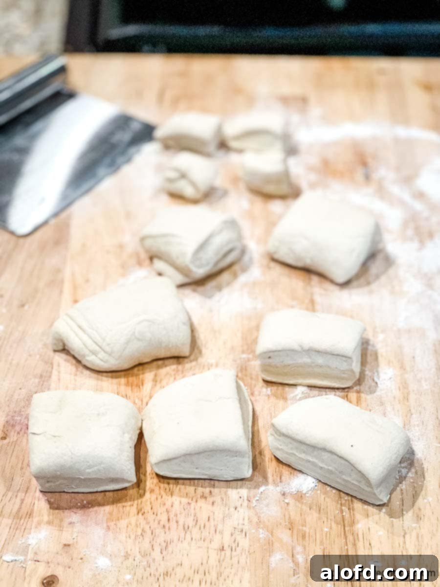 Pretzel Poppers 5 Cut sections of ready-dough on a cutting board.