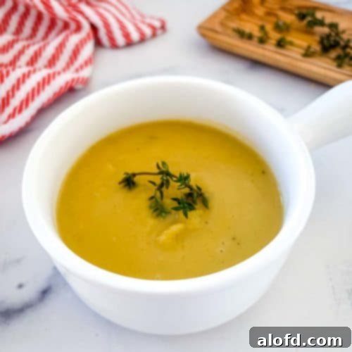 Creamy Instant Pot Acorn Squash Soup 13 a bowl of acorn squash soup.