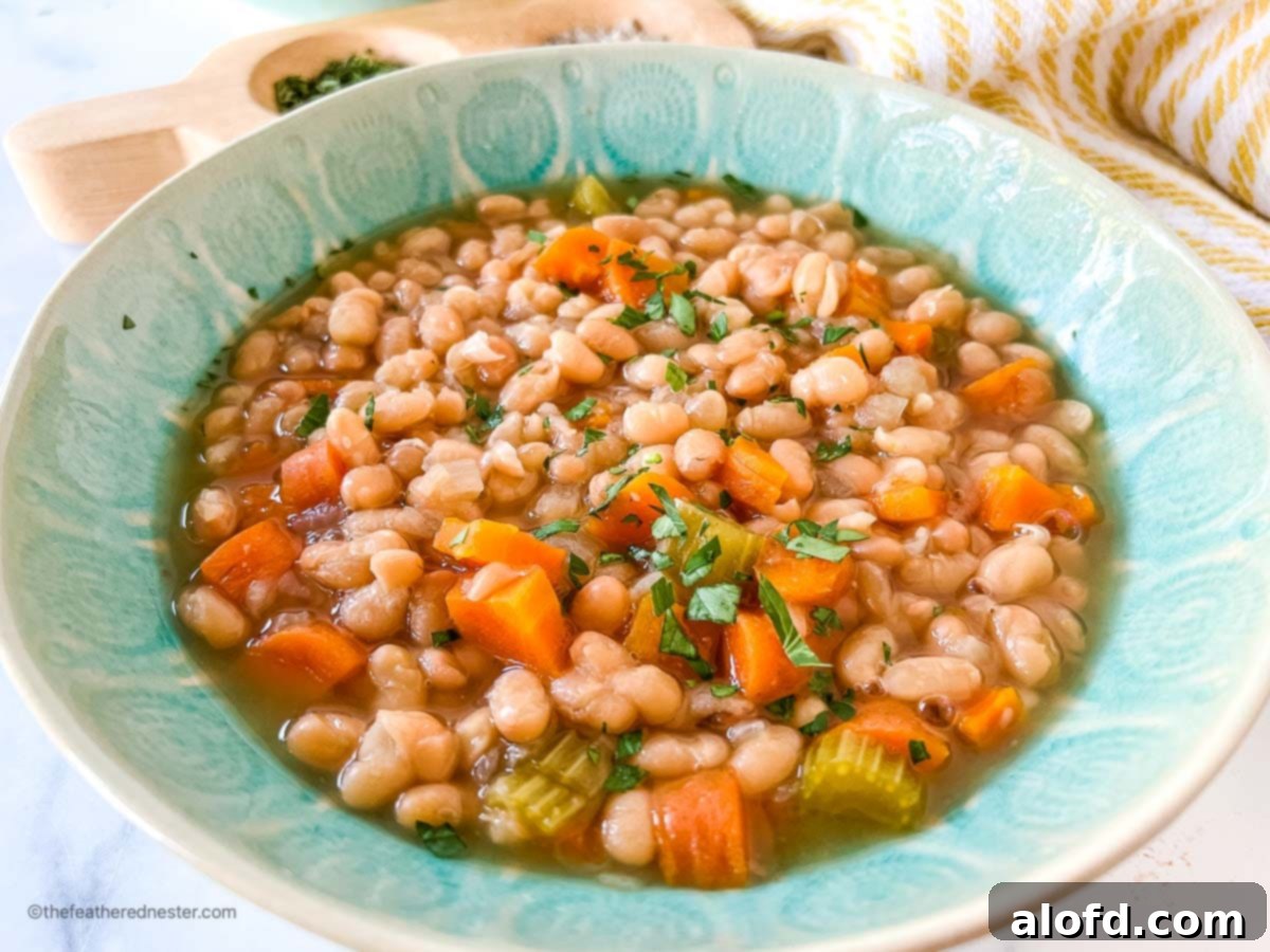 A green bowl of instant pot bean soup.