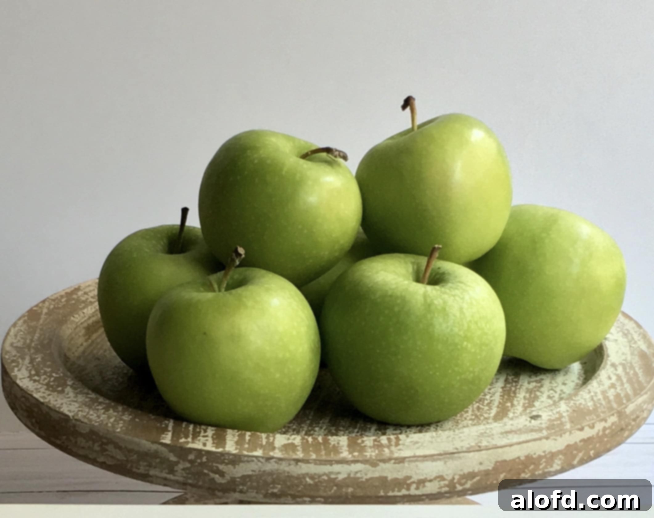 A colorful assortment of fresh apples, ready to be peeled and sliced for a delicious apple crisp.