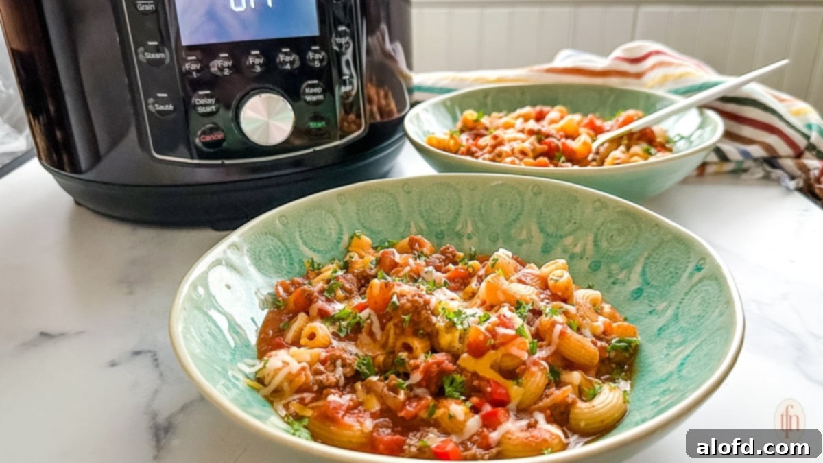 Two generous servings of chili with macaroni presented alongside an Instant Pot, highlighting a satisfying family meal.