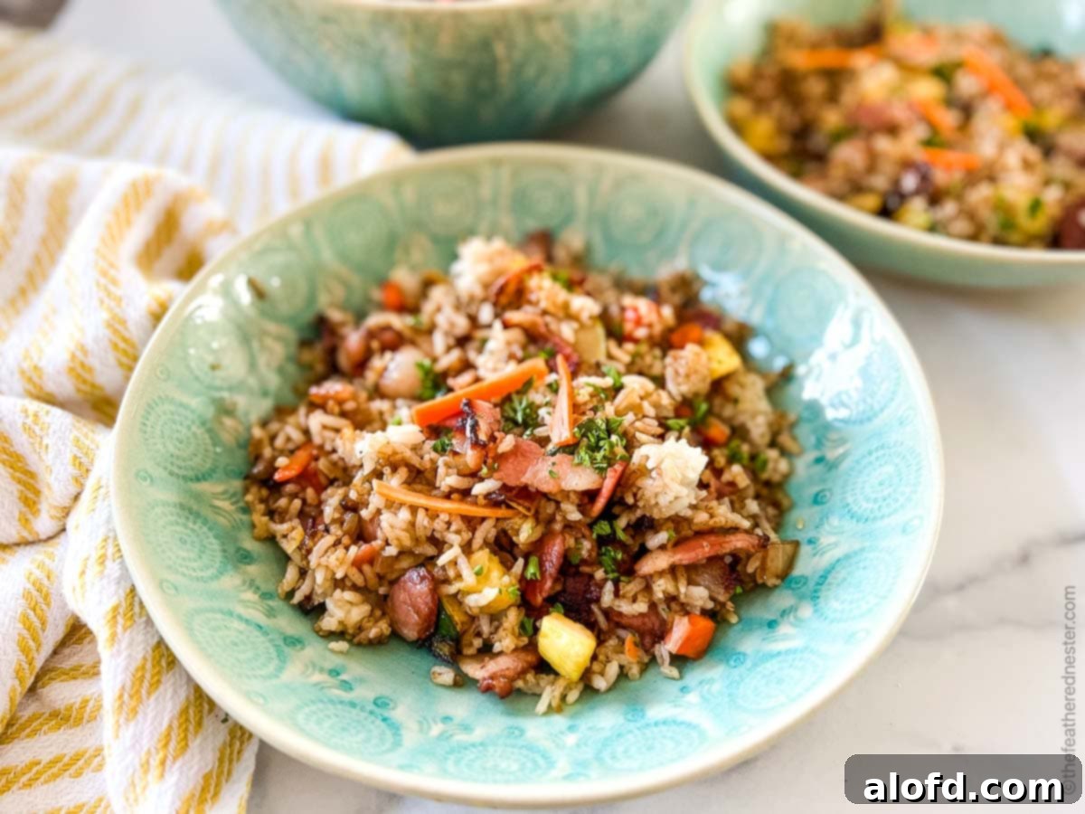 Sizzling Blackstone Fried Rice 10 A green bowl of hibachi rice.