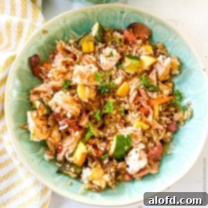 Sizzling Blackstone Chicken Fried Rice 11 a green bowl of Blackstone Chicken Fried Rice.