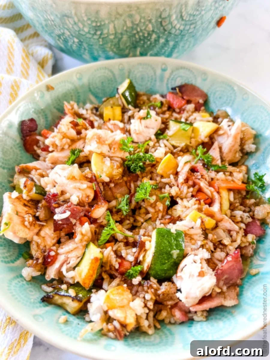 Sizzling Blackstone Chicken Fried Rice 9 a green bowl of chicken fried rice.