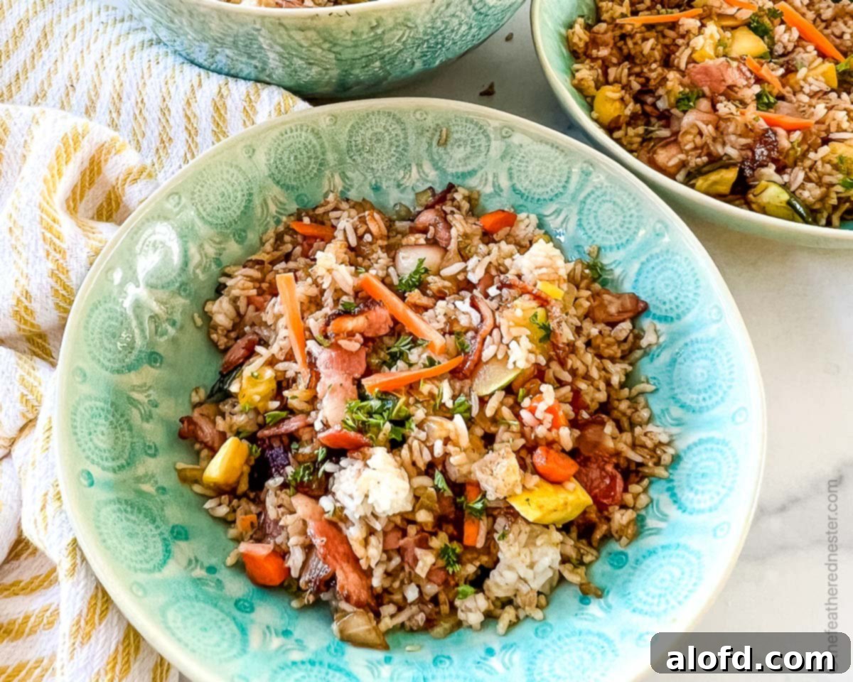 Sizzling Blackstone Chicken Fried Rice 10 green bowls of fried rice with chicken.