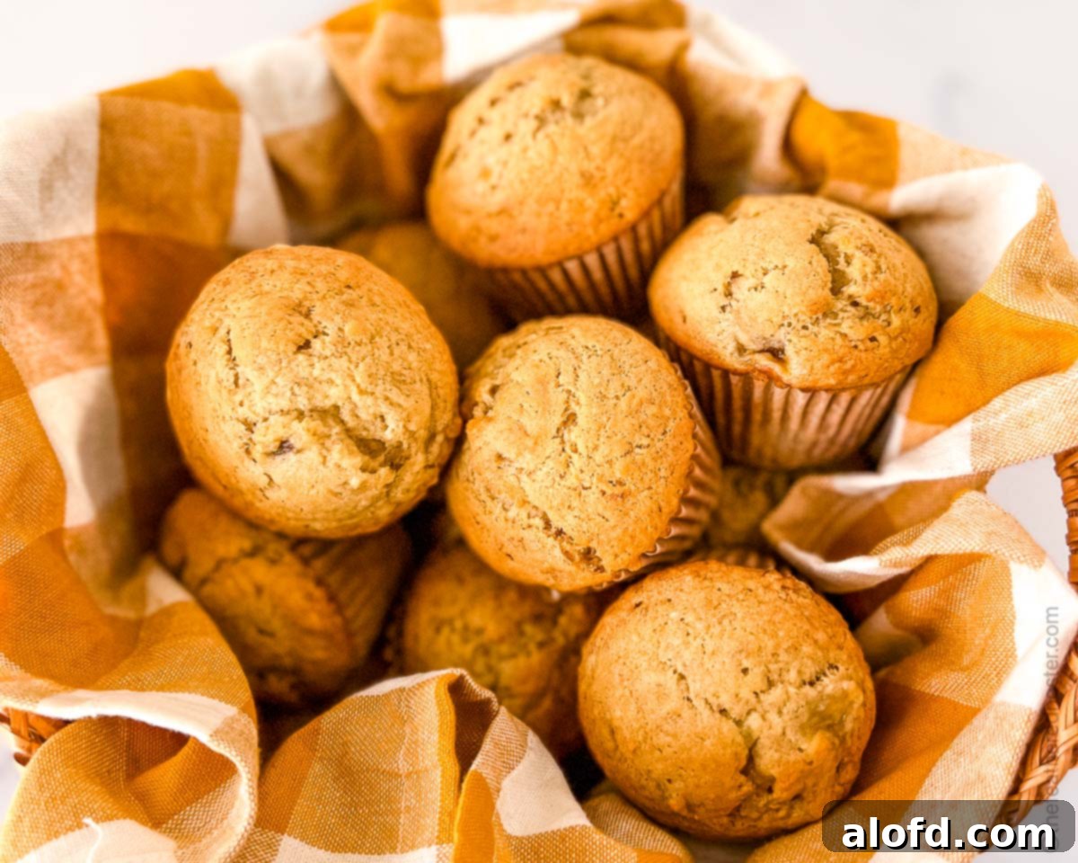 A charming basket filled with delicious banana muffins made with Bisquick, ready to be enjoyed.