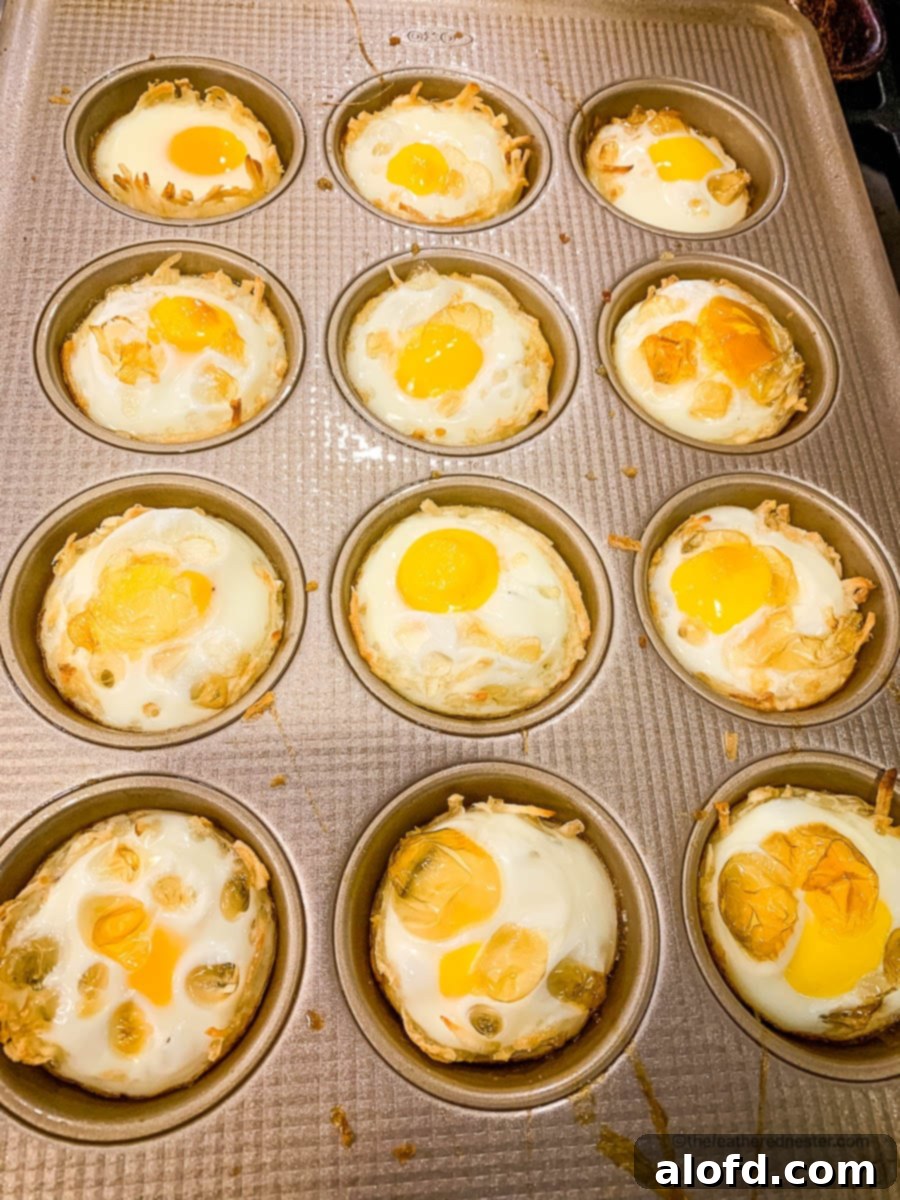 Crispy Hash Brown Egg Cups 10 Baked hash brown breakfast cups in a muffin pan.