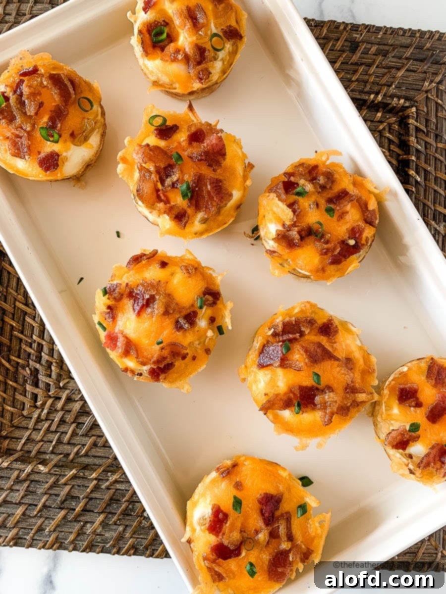 Crispy Hash Brown Egg Cups 2 Hash brown egg cups on a white serving platter.