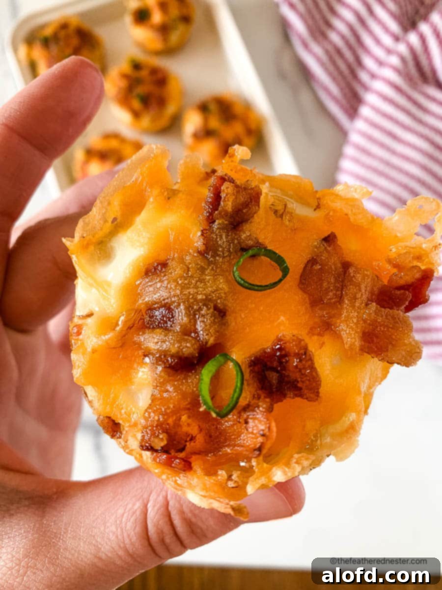 Crispy Hash Brown Egg Cups 5 a hand holding a piece of baked hashbrown cup.