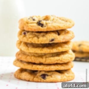 A stack of perfectly baked white chocolate raspberry cookies, ready to be enjoyed.
