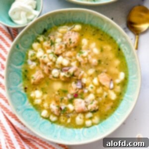 Speedy Instant Pot Pozole 11 A large, inviting bowl of Instant Pot Pozole Verde, garnished and ready to be served.