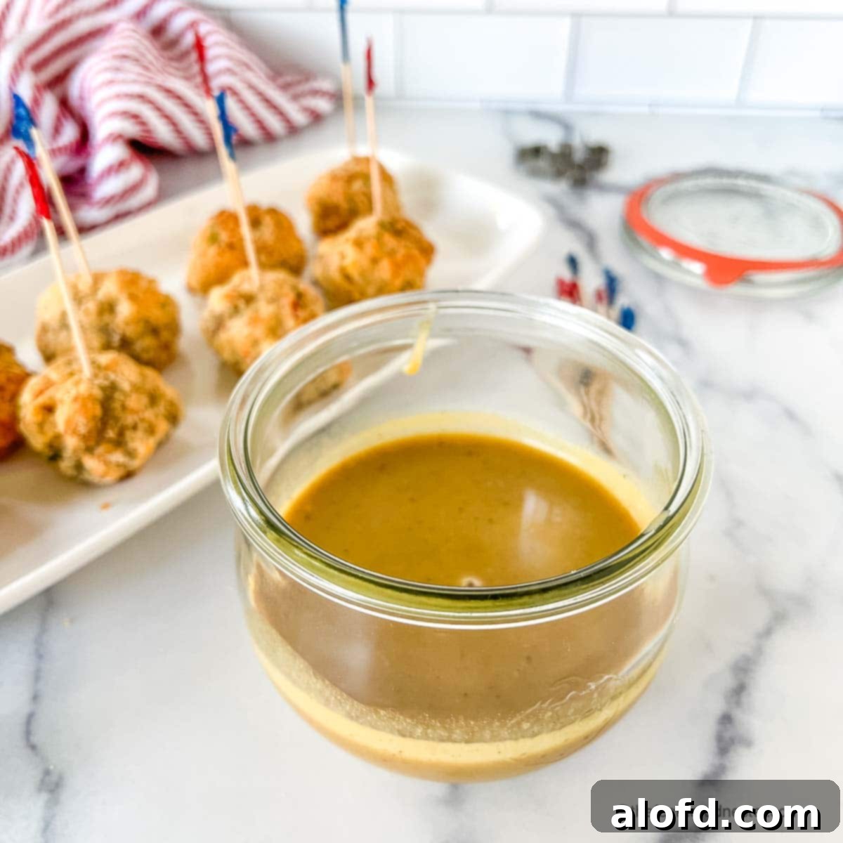 Zesty Honey Mustard Sauce 3 A Weck jar filled with rich orange-brown spicy honey mustard sauce.
