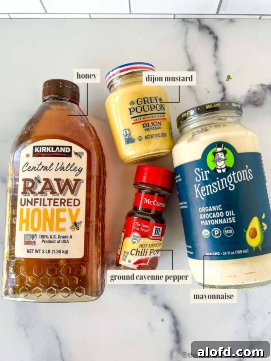 Zesty Honey Mustard Sauce 4 Containers of honey, Dijon mustard, mayonnaise, and cayenne pepper, the essential ingredients for sweet spicy mustard.