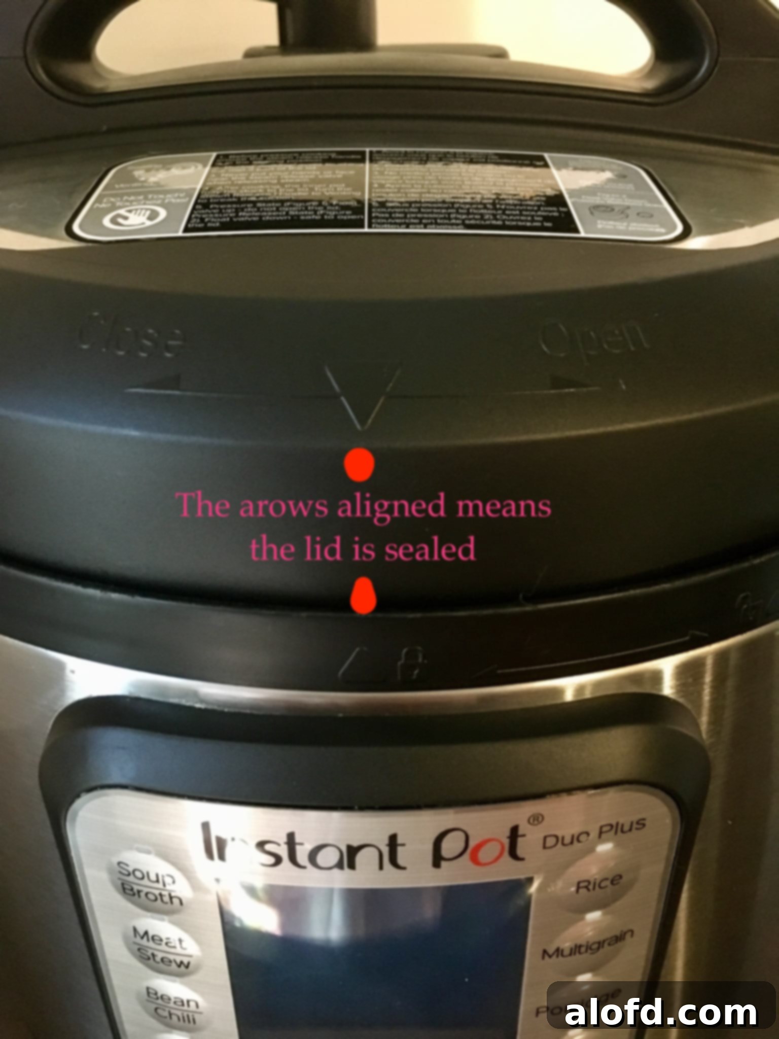 How to lock the instant pot lid: basics of pressure cooking, showing alignment arrows.