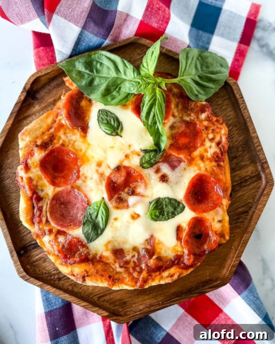 Flame-Kissed Pizza 2 Fire-grilled pizza on a grill, showcasing a crispy crust and melted toppings, ready to be enjoyed.