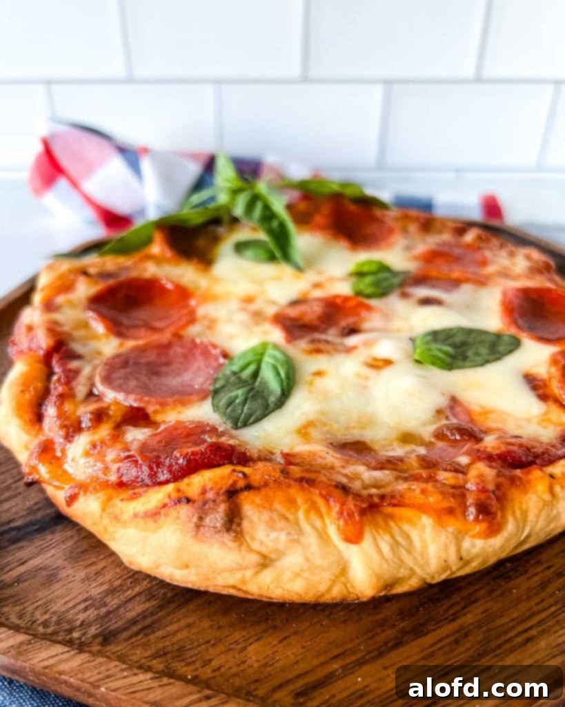 Flame-Kissed Pizza 13 A delicious fire-grilled pizza on a wooden serving tray, garnished with fresh basil.