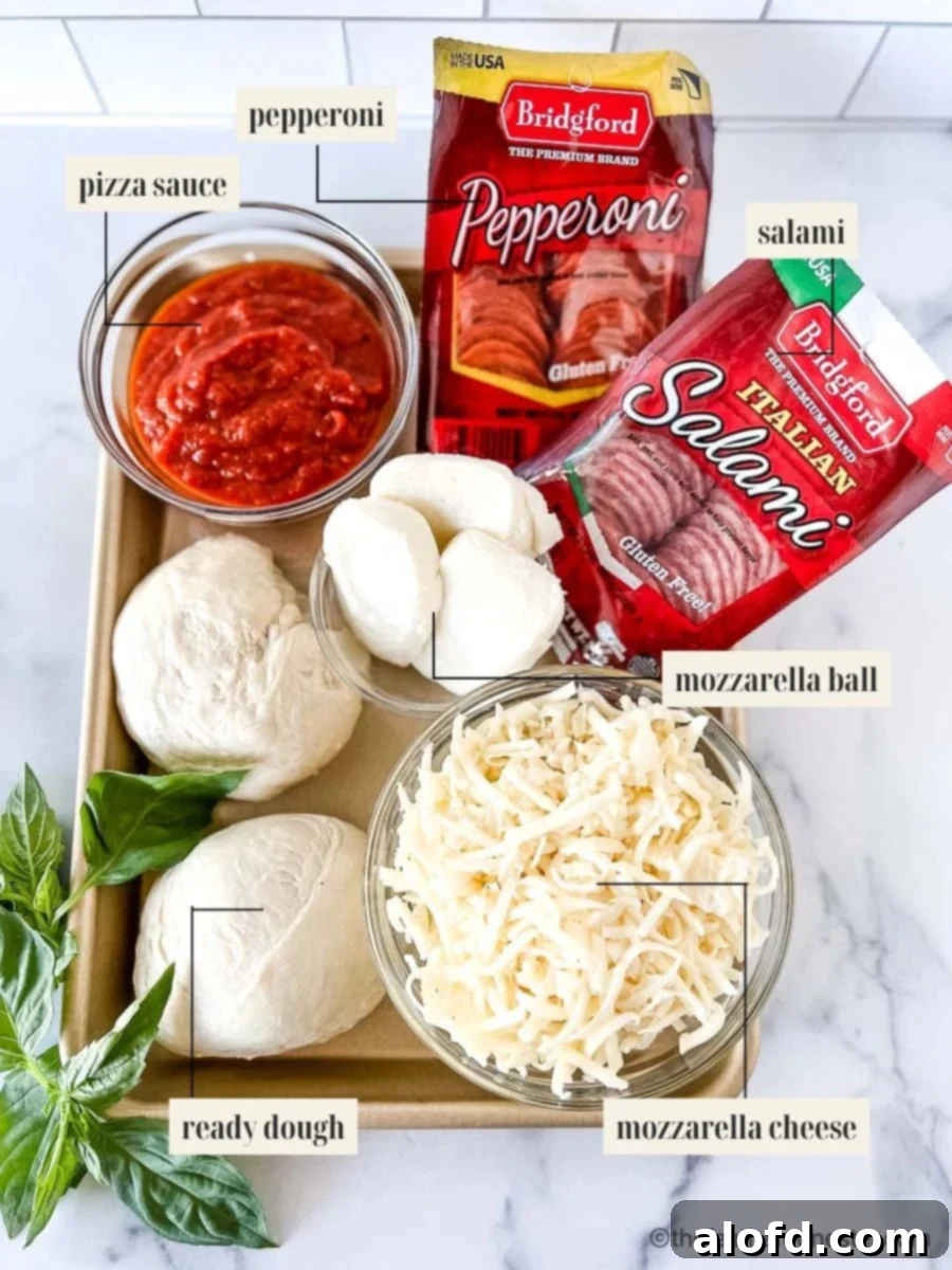 Flame-Kissed Pizza 3 Labeled ingredients for a fire grilled pizza recipe, including frozen dough, sauces, cheeses, and various toppings.