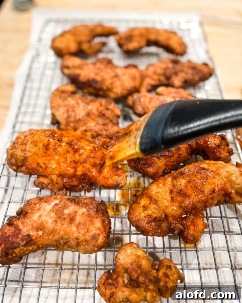Fiery Nashville Chicken Strips 11 Basting spicy butter sauce on the Nashville hot chicken tenders.