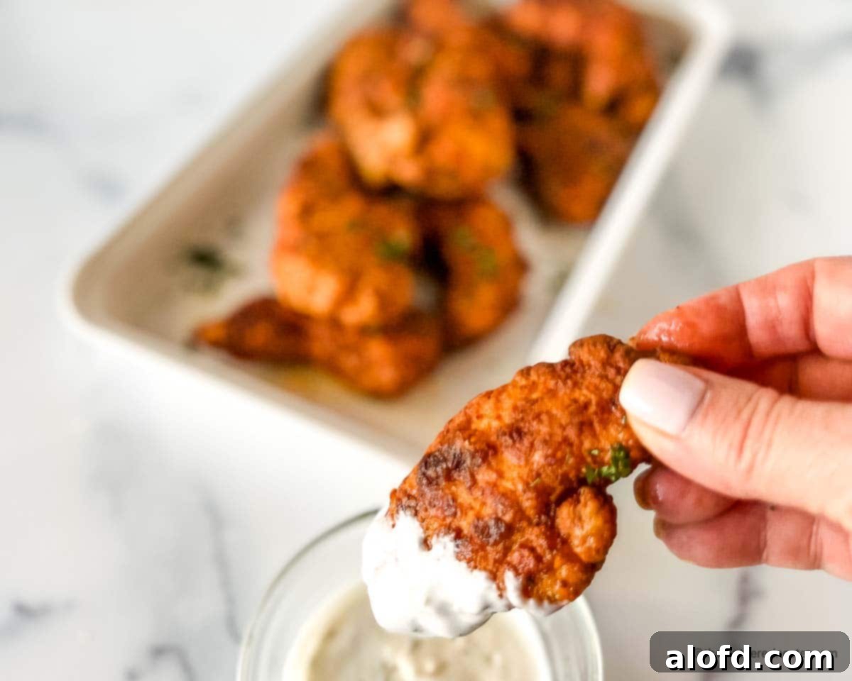 Fiery Nashville Chicken Strips 3 Nashville chicken tenders dipped in a blue cheese dressing.
