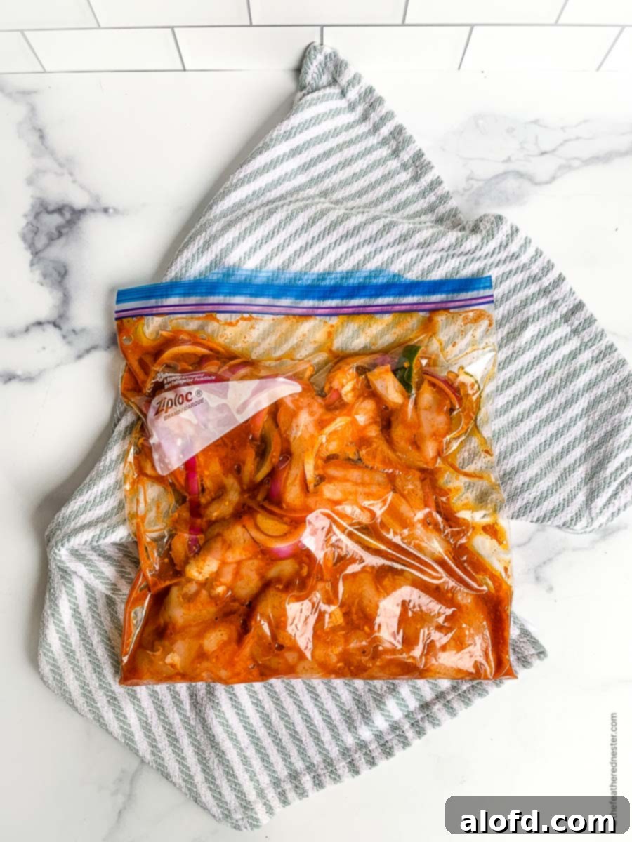 Marinated chicken tenderloins infused with fajita seasoning, resting in a sealed Ziplock bag, ready for cooking on the Blackstone griddle.