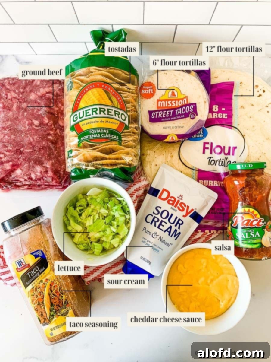 Blackstone's Ultimate Crunchwrap 4 Ingredients for a homemade Blackstone Crunchwrap recipe laid out: ground beef, tostadas, small and large flour tortillas, taco seasoning mix, fresh lettuce, creamy sour cream, rich cheddar cheese, and vibrant salsa.