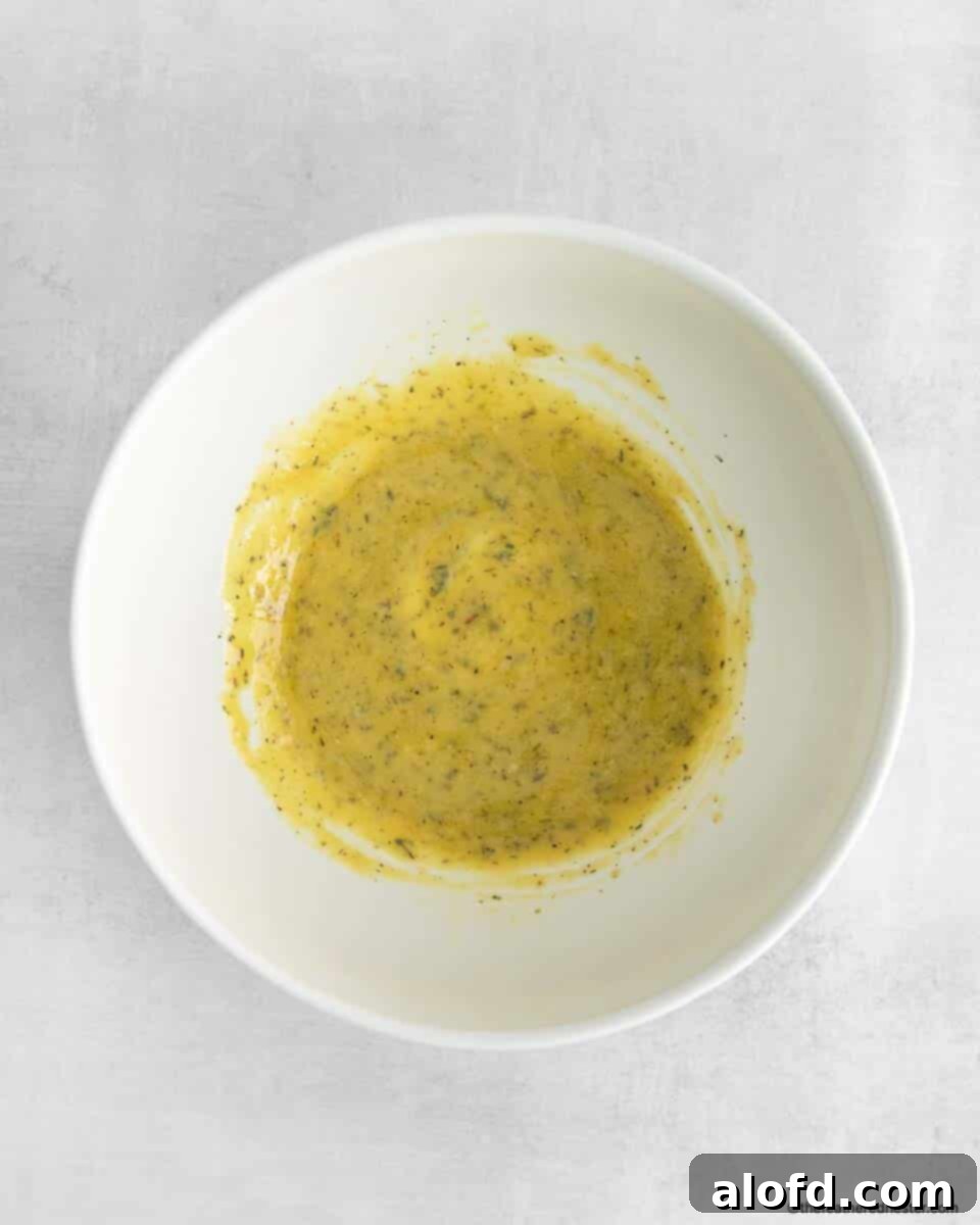 Vibrant Italian Bean Medley 6 Small bowl of homemade creamy vinaigrette dressing, ready for the salad.