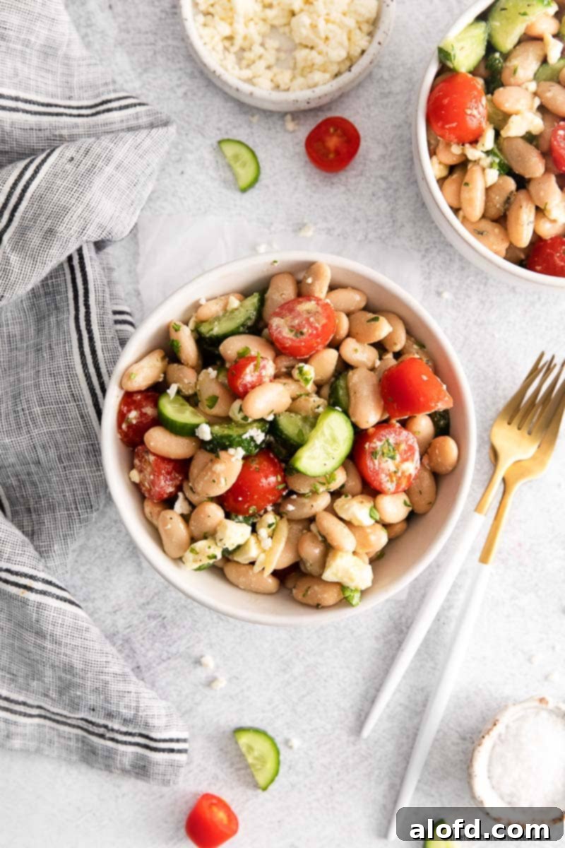 Vibrant Italian Bean Medley 9 A beautiful serving of Tuscan salad with creamy cannellini beans and garden vegetables, presented elegantly.