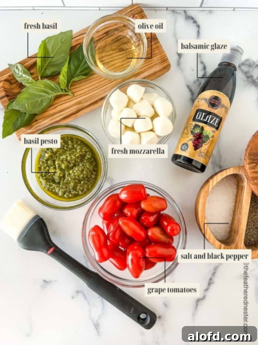 Classic Margherita Flatbread 4 Labeled ingredient image for flatbread pizza margherita recipe, showing close-up of fresh basil, mozzarella, grape tomatoes, pesto, and olive oil.