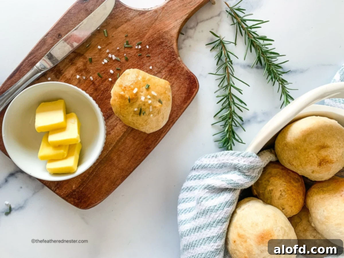 Rustic Sourdough Buns 13 Horizontal photo of sourdough rolls on a basket and a wooden board.