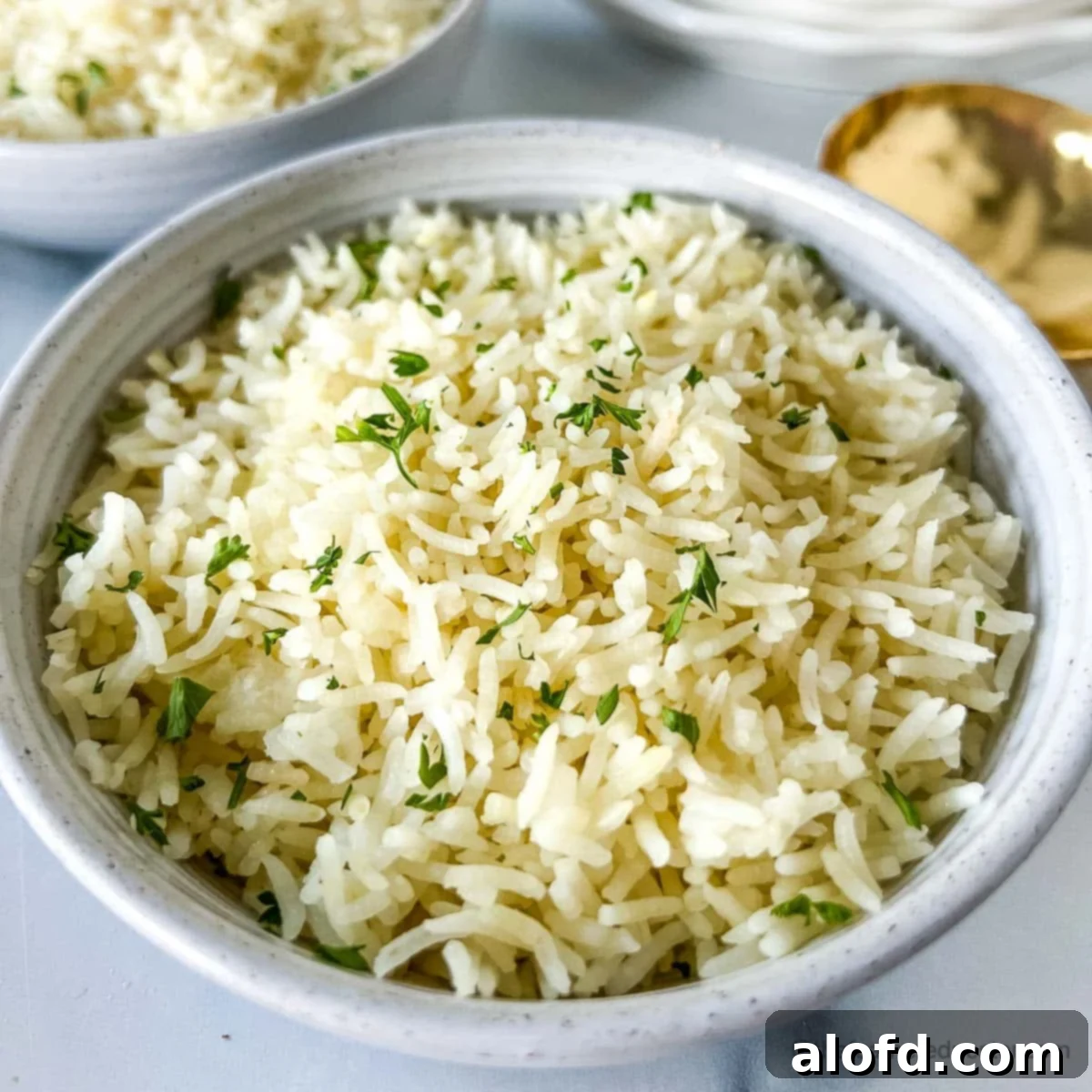 Perfect Instant Pot Basmati Rice 9 A white bowl of Instant Pot Rice ready to serve.