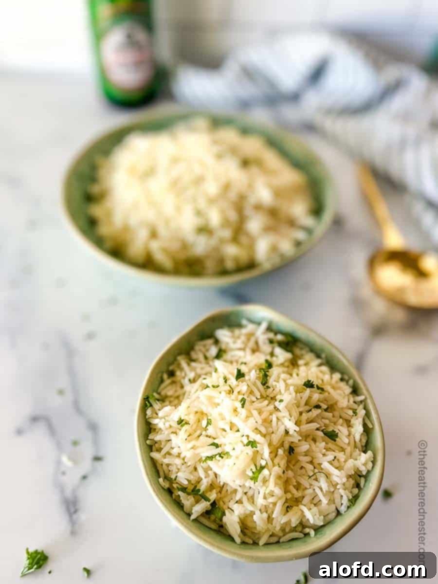 A vibrant green bowl filled with fluffy Instant Pot Jasmine rice, accompanied by a golden serving spoon. A striped cloth, a bottle of soy sauce, and another large bowl of rice are visible in the background, creating a comforting culinary tableau.