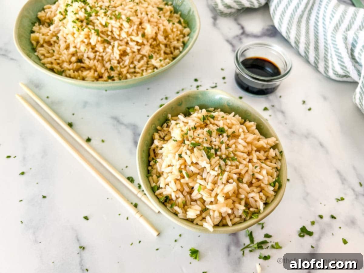 Fluffy Instant Pot Brown Basmati Rice 3 Two serving bowls filled with perfectly cooked Instant Pot brown basmati rice, ready to be enjoyed.
