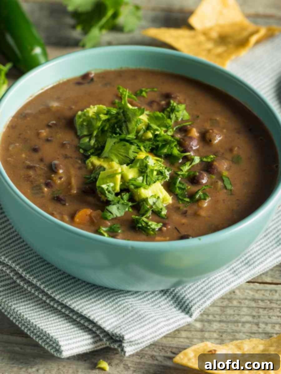 Easy Instant Pot Black Beans 2 Instant Pot Black Beans made into a stew in a green bowl.