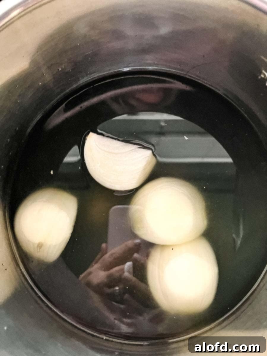 Easy Instant Pot Black Beans 5 Sliced onions placed into an Instant Pot.