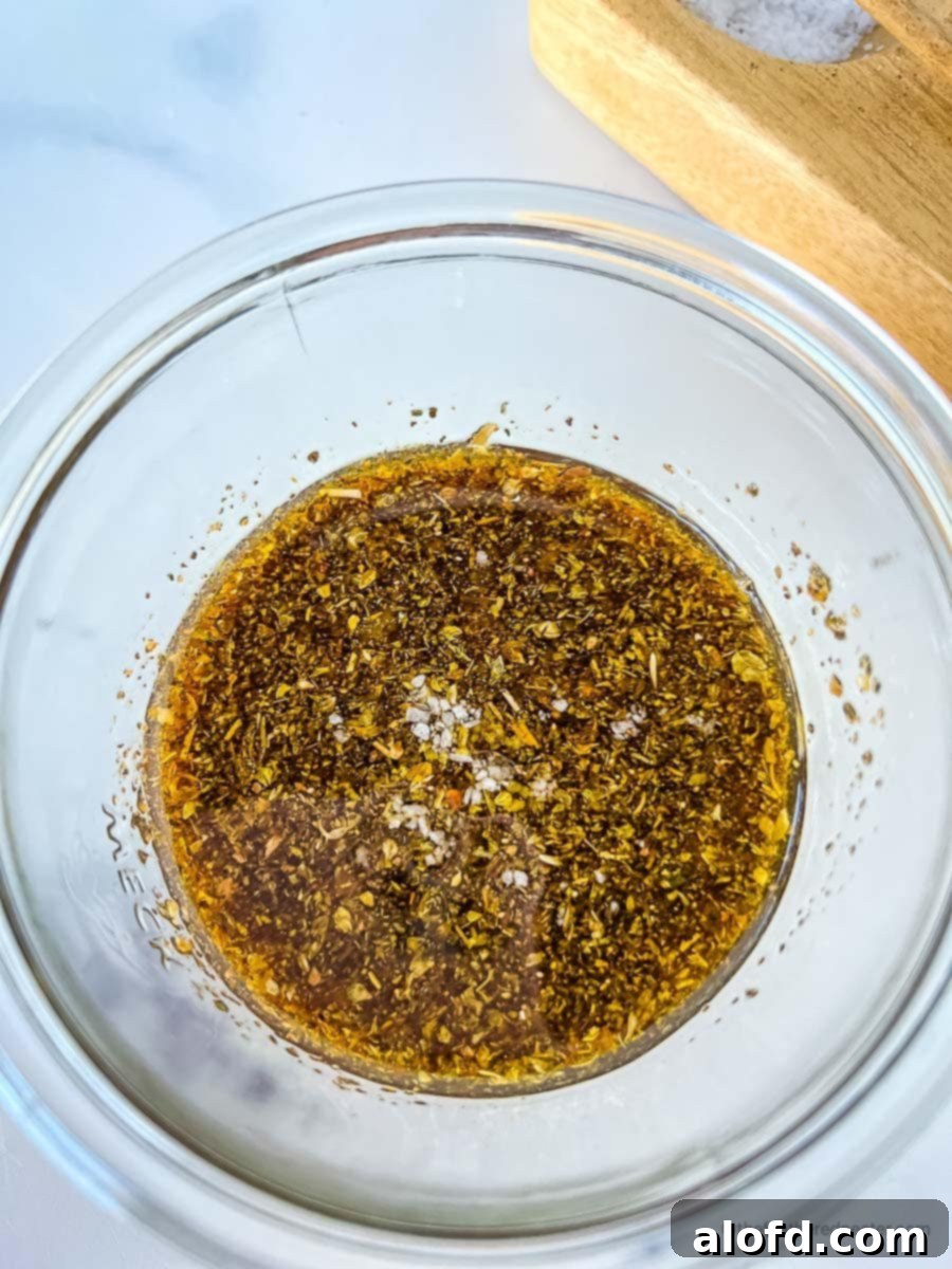 Sweet and Tangy Balsamic Chicken Marinade 5 All the ingredients for balsamic vinegar chicken marinade are placed in a clear mixing bowl.