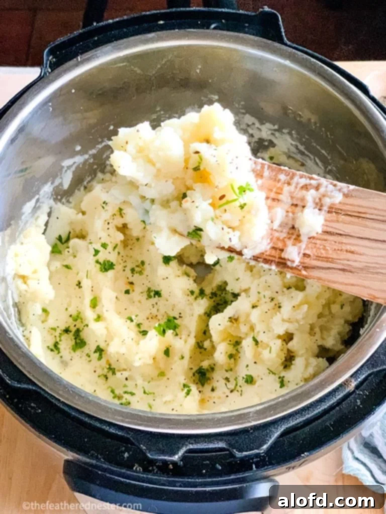 Our Top 5 Thanksgiving Dinner Recipes 9 A bowl of fluffy, creamy Instant Pot mashed potatoes, perfect for a Thanksgiving dinner for 6.