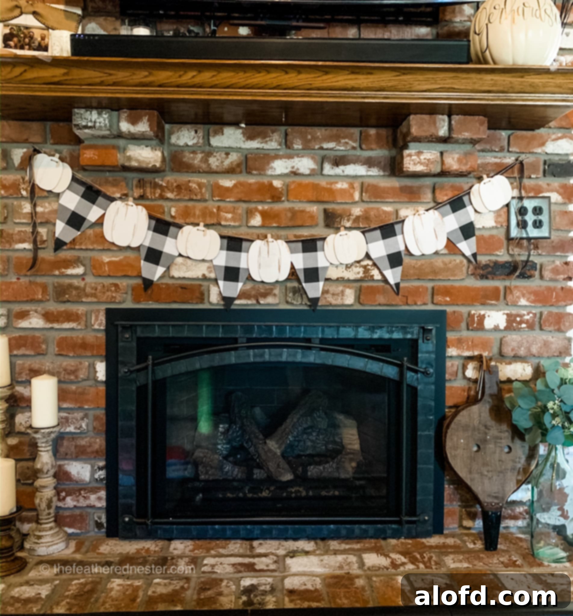 Fabric pennant garland with pumpkins, showcasing autumn decor.