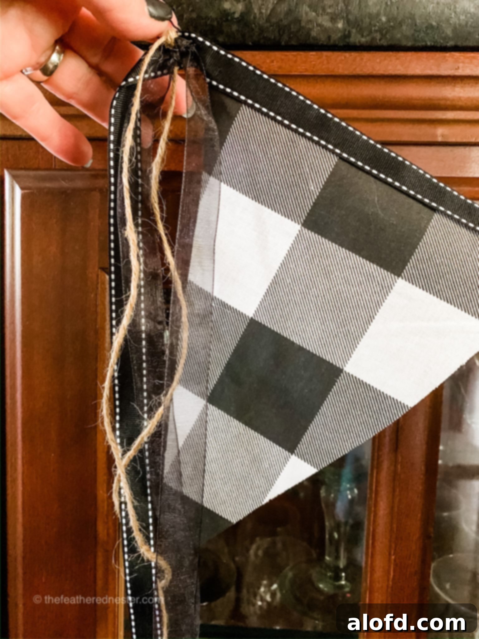 Hanging fabric garland on a wall, showcasing finished decor.