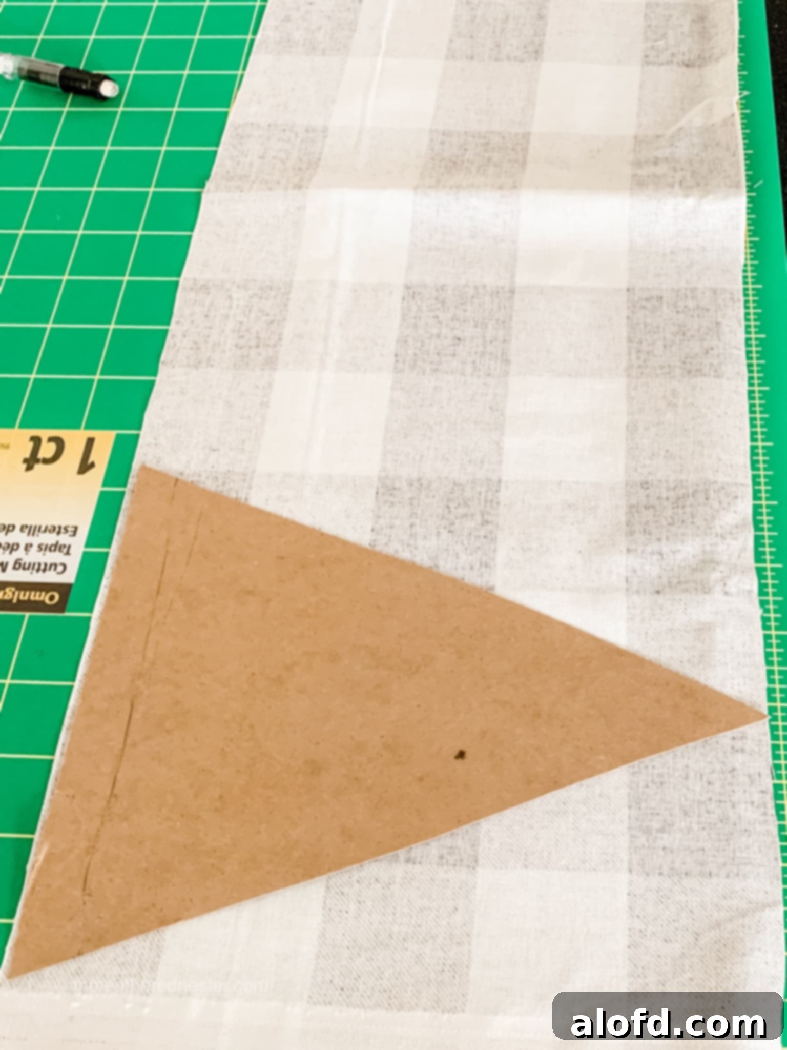 Layout of fabric pennants on a table, illustrating the cutting process.