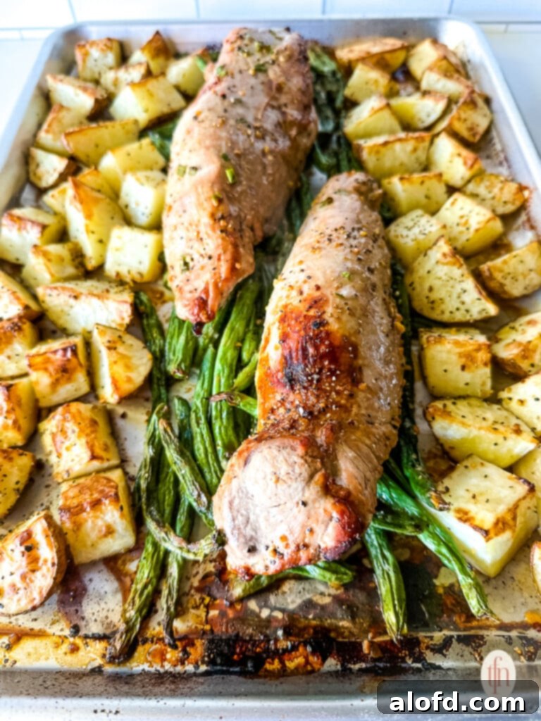 Effortless Sheet Pan Pork Tenderloin 2 Sheet pan pork tenderloin dinner with potatoes and green beans.