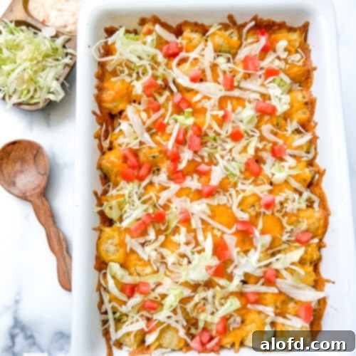 Cheeseburger tater tot casserole in a white baking dish, ready to serve.