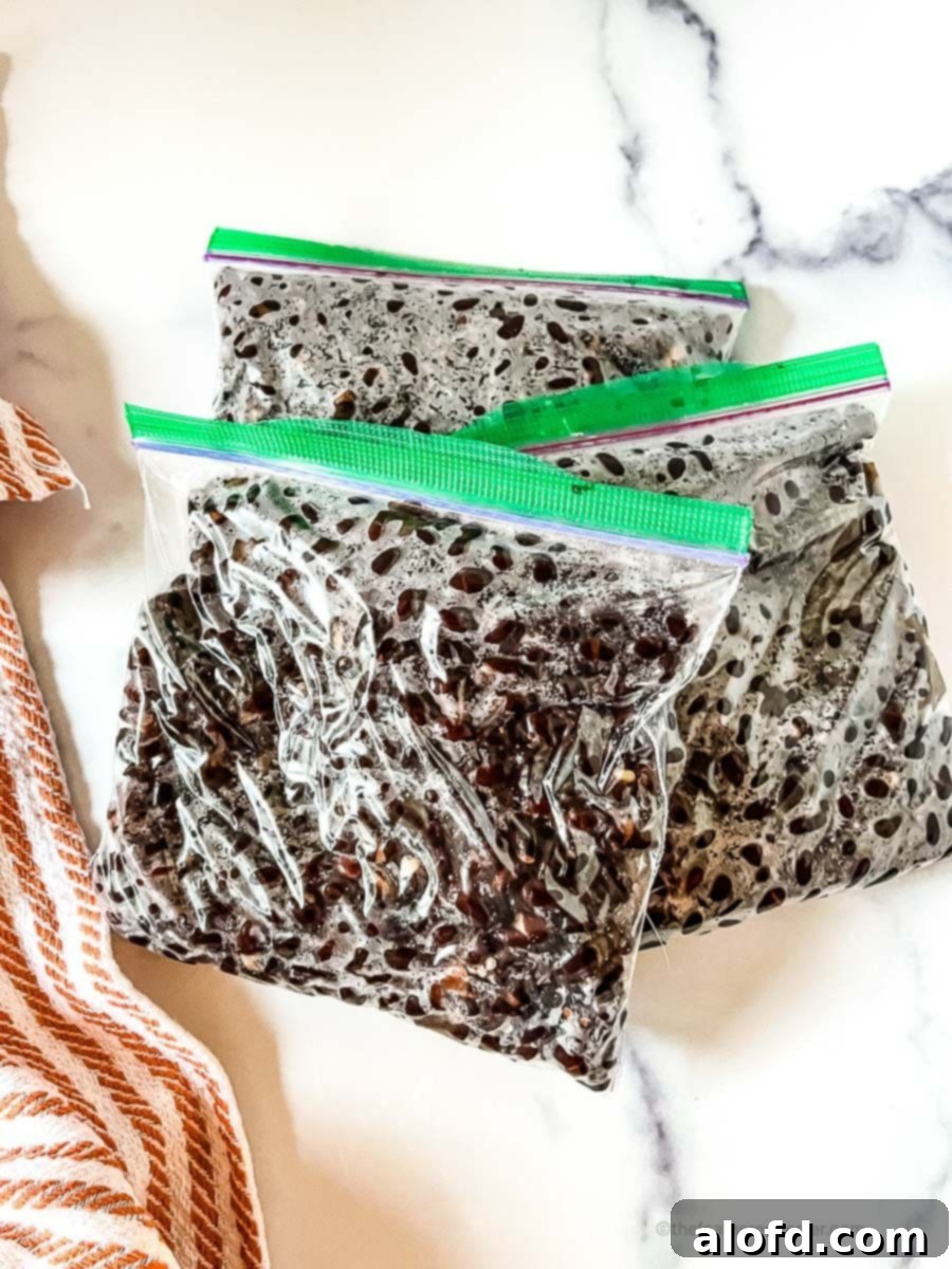 Beyond the Can: 3 Smart Ways to Cook Dried Beans 11 Instant Pot black beans ready for storage placed in a Ziploc bag.