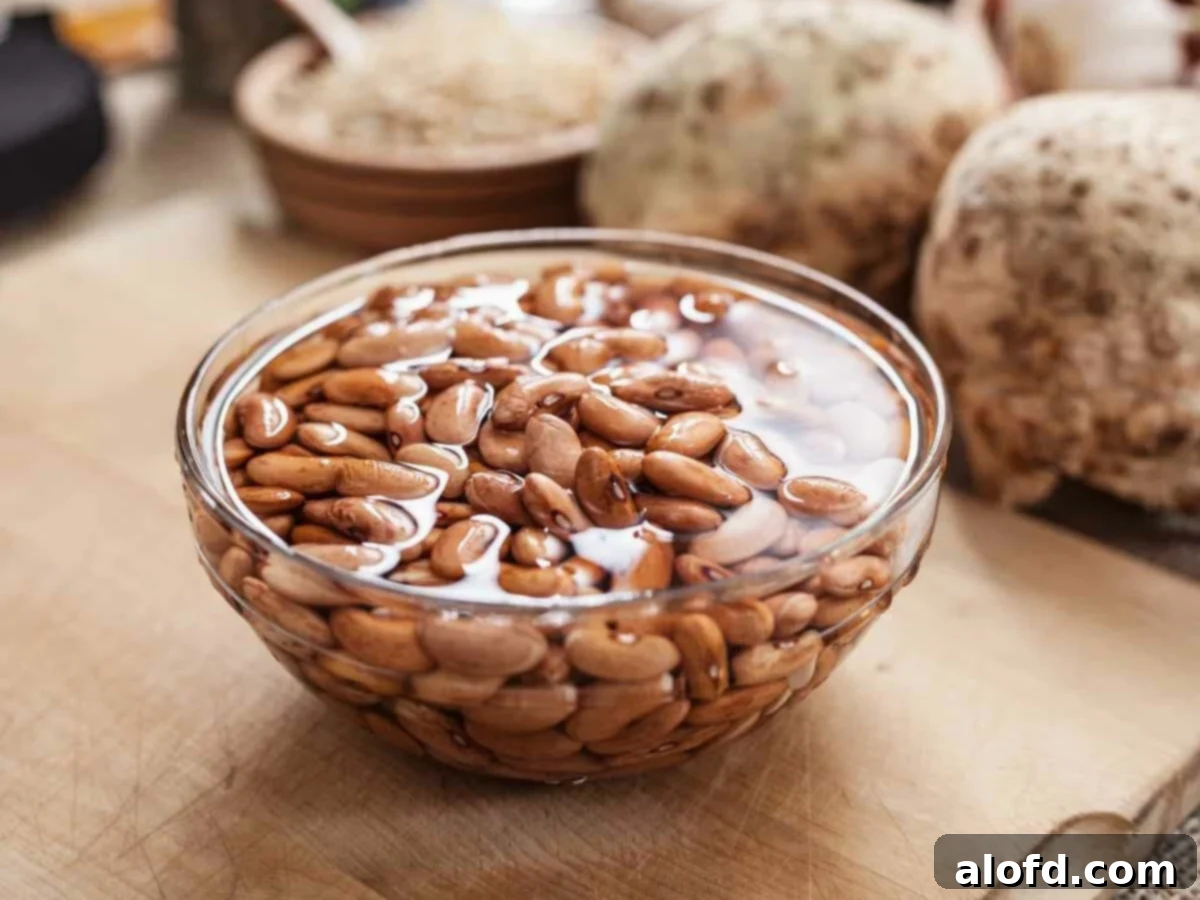 Beyond the Can: 3 Smart Ways to Cook Dried Beans 6 Pinto beans soaking in a water filled bowl.