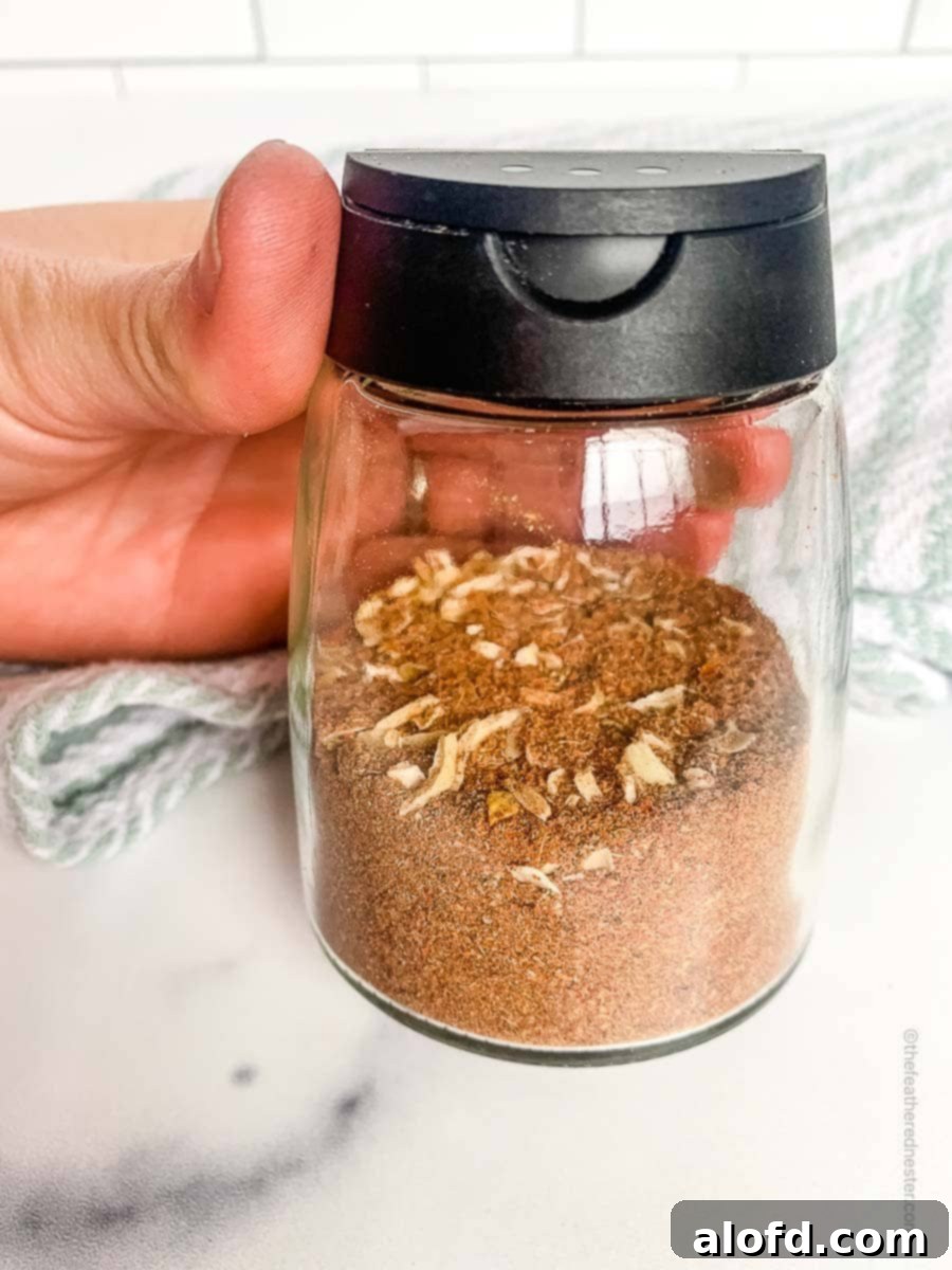 Ultimate Chicken Taco Mix 7 Chicken taco seasoning inside a small spice container.