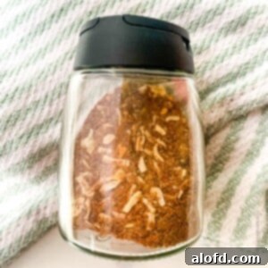 Ultimate Chicken Taco Mix 10 chicken taco spice mix inside a spice container.