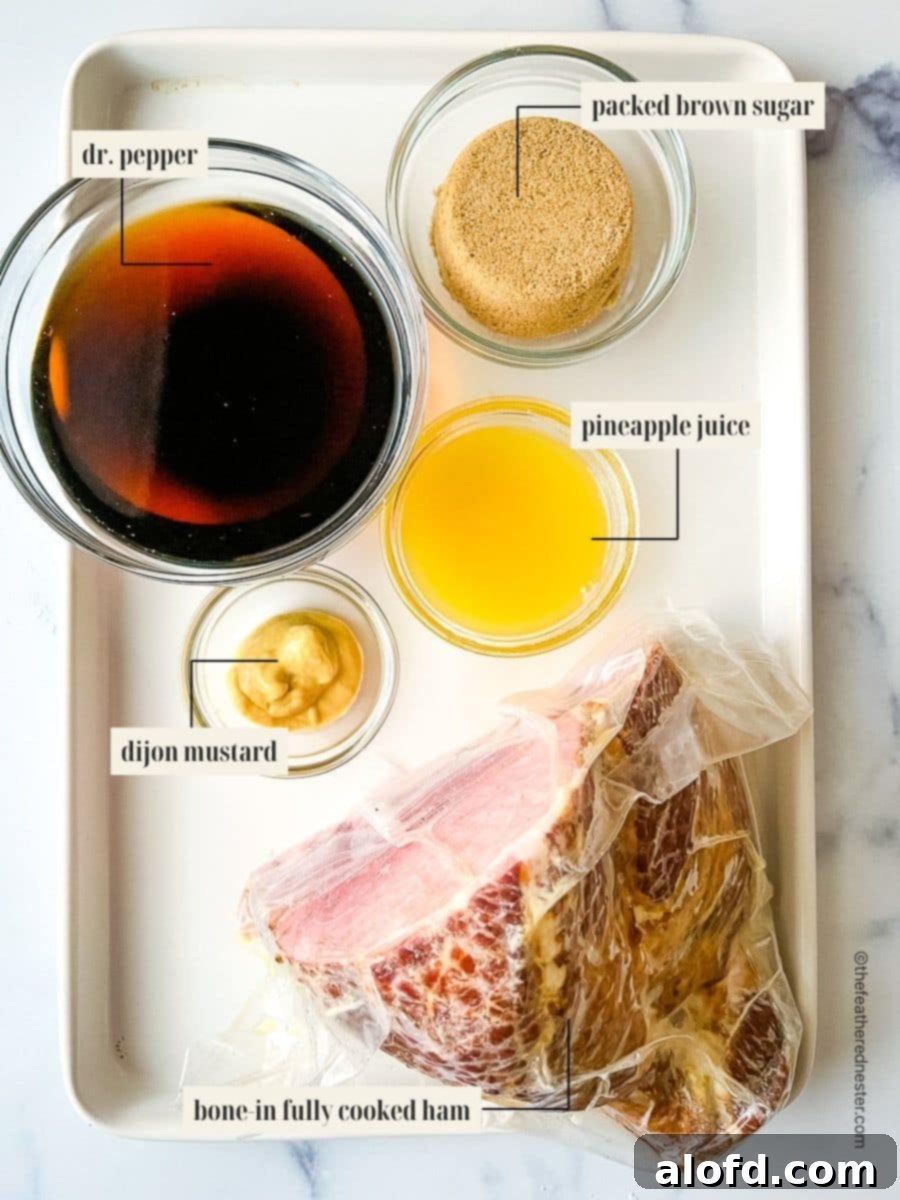A clear image showing all the essential ingredients laid out for making the Dr. Pepper ham: a pre-cooked spiral ham, a can of Dr. Pepper, a bowl of brown sugar, a jar of Dijon mustard, and a can of pineapple juice.