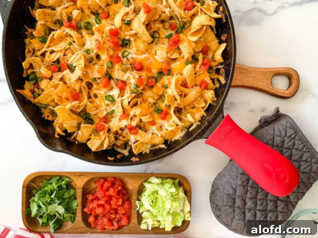 Loaded Taco Bake 10 A hearty Tex-Mex skillet meal, brimming with colorful ingredients, artfully placed on a trivet, inviting eager appetites.